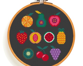 May include: A colorful embroidery hoop with a black background and a variety of fruit designs, including a strawberry, watermelon, pineapple, kiwi, peach, pear, orange, grapes, and cherries.