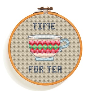 May include: Embroidered hoop art featuring a colourful teacup and the text "TIME FOR TEA".