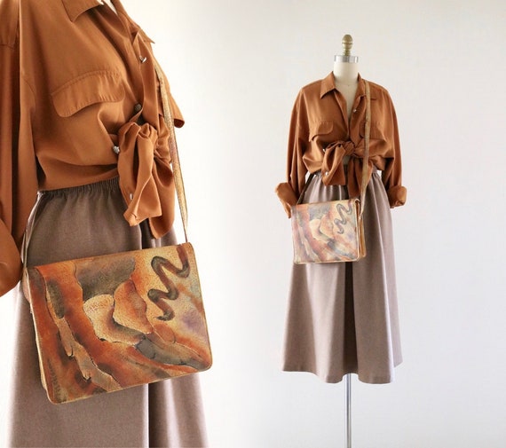 painted leather cross body bag