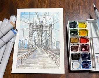 Puede incluir: Una acuarela del puente de Brooklyn que muestra una torre central de piedra, cables de suspensión y el horizonte de la ciudad. La obra incluye el texto 'JR 2026 - BROOKLYN, NY' en la parte inferior izquierda. Marcadores grises y acuarelas están cerca.