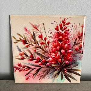 May include: A square ceramic tile featuring a watercolour painting of a bouquet of red flowers with green leaves on a light beige background.