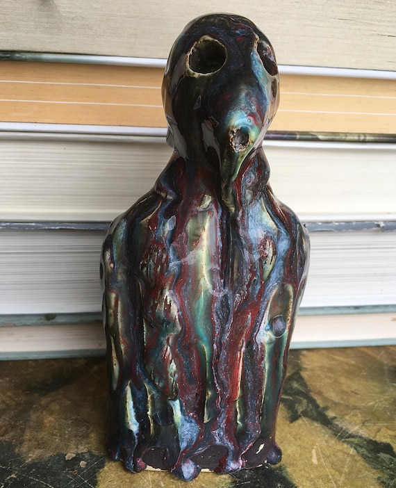 A hand-sculpted ceramic 'drip monster' figurine — weird, charming, and clearly made by a human hand with a genuine sense of humor.