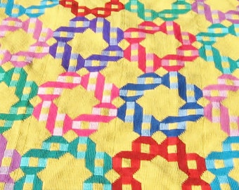 Tunisian Crocheted Ribbon Rings QUILT-LQQK afghan in rich gem-tone colors on golden background.