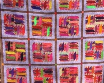 Tunisian Crocheted Butterfly Spanish Steps QUILT-LQQK afghan in green, yellow, orange, red, purple, pink, tan, and lilac.