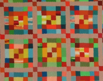 Tunisian Crocheted Beachy Jelly Roll Jumble QUILT-LQQK afghan in shades of green, orange, yellow, and turquoise