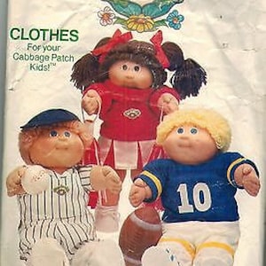 May include: A vintage Cabbage Patch Kids sewing pattern for making clothes for dolls. The pattern includes instructions for making a baseball uniform, a cheerleader outfit, and a football jersey. The pattern is from Butterick and has the number 6827.