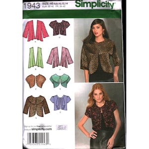 May include: A Simplicity 1943 sewing pattern envelope featuring illustrations of various jacket and bolero styles. The cover displays two photographs of models wearing a leopard print jacket and a black and red floral print bolero over black tops.