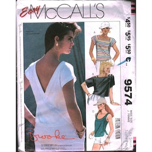 May include: Easy McCall's 9574 sewing pattern envelope featuring Brooke Shields. The front displays a white top with a deep V-back, alongside illustrations of four different top styles including striped, black, and green designs with various necklines.