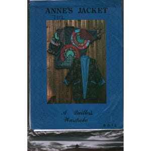 May include: A sewing pattern envelope titled ANNE'S JACKET 7112 A Quillers Wardrobe 8012. The blue packaging displays two jackets: one with circular and geometric patchwork in red, green, and black, and another in dark textured fabric with blue trim.