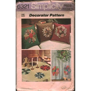 May include: A vintage Simplicity Decorator Pattern featuring images of decorative pillows, a tablecloth with starburst designs, and curtains with colorful appliqués. The pattern includes instructions for various home decor projects.