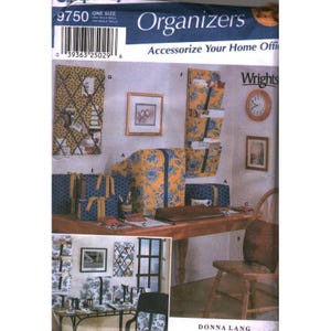 May include: A sewing pattern envelope labeled 9750 Organizers by Wrights, featuring illustrations of fabric-covered home office accessories. The items include a wall-mounted memo board, a hanging pocket organizer, and desk storage boxes in yellow and blue floral patterns.