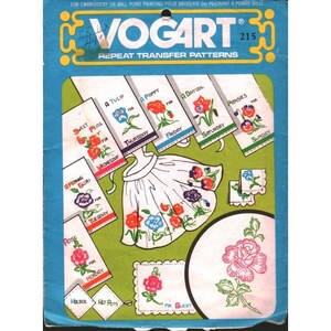 May include: A Vogart 215 repeat transfer pattern packet featuring embroidery designs for days of the week, including flowers like roses, tulips, poppies, daffodils, and pansies. The blue and green packaging displays illustrations of an apron and hot pads.