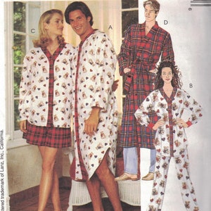 May include: A sewing pattern for a set of pajamas featuring a white robe with a teddy bear and heart print, a red and black plaid robe, and a white pajama set with a teddy bear and heart print. The pattern is from McCall's and is for Lanz of Salzburg.