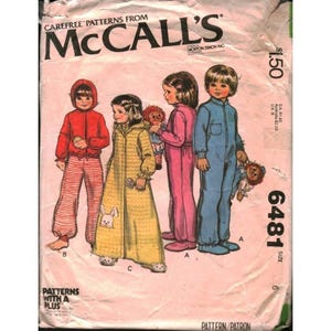 May include: A vintage McCall's sewing pattern envelope 6481 featuring illustrations of children in loungewear. The cover shows a child in a red hooded top and striped pants, a child in a yellow robe with a rabbit graphic, and two children in jumpsuits.