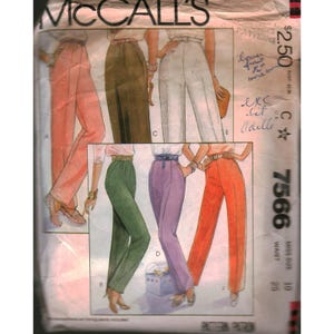 May include: A vintage McCall's sewing pattern featuring illustrations of high-waisted pants in various colors: peach, olive green, white, purple, and orange. The pattern number is 7566, with a waist size of 25 inches and a price of $2.50.