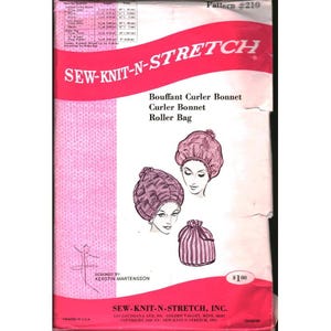 May include: A vintage sewing pattern envelope for a Sew-Knit-N-Stretch bouffant curler bonnet, curler bonnet, and roller bag, pattern number 210. The pink and white packaging features illustrations of the finished items and a material list.
