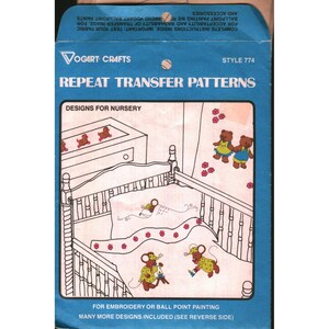 May include: A blue Vogart Crafts Repeat Transfer Patterns envelope, style 774, featuring Designs for Nursery. The front displays a line drawing of a crib with mice characters, floral accents, and text for embroidery or ball point painting.