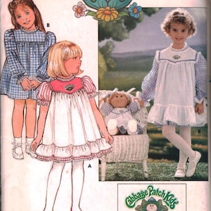 Puede incluir: Patrón de costura Butterick vintage con diseños de Cabbage Patch Kids. La imagen muestra vestidos infantiles con volantes y detalles. El empaque tiene el logotipo de Cabbage Patch Kids y el texto "FREE PATTERN".