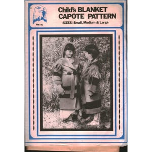 May include: A sewing pattern envelope titled Child's BLANKET CAPOTE PATTERN PM 91, featuring a black and white photograph of two children wearing hooded coats with horizontal stripes and fringe details, available in sizes Small, Medium, and Large.