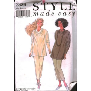 May include: A sewing pattern envelope labeled Style made easy 2336 size A (8-18) featuring illustrations of two outfits. Each outfit consists of a long-sleeved tunic top and a matching straight-cut skirt, shown in light yellow and dark brown.