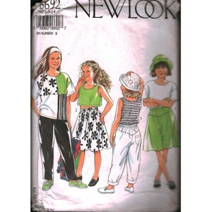 May include: A vintage New Look sewing pattern with illustrations of girls' outfits. The designs include a floral top and black trousers, a green crop top and floral skirt, a striped top and white trousers, and a white t-shirt and green skirt.