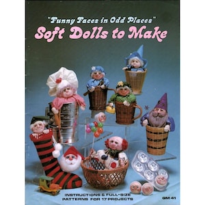 May include: A craft book cover titled Funny Faces in Odd Places Soft Dolls to Make featuring seventeen projects. The image displays various handmade soft dolls, including figures in baskets, a stocking, and a flour sifter, with instructions included.