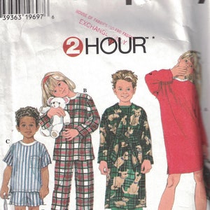 May include: Simplicity sewing pattern number 7407 for children's pajamas. The pattern includes three different styles: a red nightgown, a plaid pajama set, and a green robe with a dog print. The pattern is labeled "2 Hour" and "House of Fabrics/So-Fro Fabrics Exchange".
