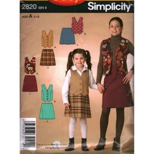 May include: Simplicity sewing pattern for girls' vests and skirts. The pattern includes various vest styles, including a floral print and solid colors, paired with a plaid or solid skirt. The size range is A 3-12.