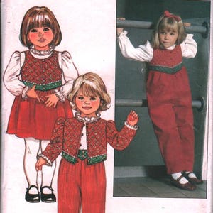 May include: Vintage Butterick sewing pattern with illustrations of children's outfits. The pattern includes a red dress, jacket, and trousers set with green trim. The pattern size is 2-3-4. The pattern is designed by Ruth Scharf.