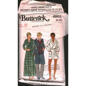May include: Vintage Butterick sewing pattern envelope featuring illustrations of three men's robes. The envelope is white with the Butterick logo and pattern number 6904. The chest size is 40 inches.