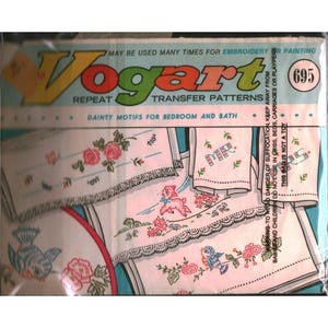 May include: A Vogart repeat transfer patterns package, number 695, featuring dainty motifs for bedroom and bath. The packaging displays illustrations of embroidered linens with floral, bird, and animal designs, including Mr. and Mrs. text.