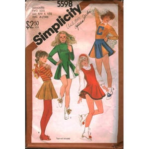 May include: A Simplicity 5598 sewing pattern envelope for young junior and teen sizes 9/10 and 11/12. The cover features illustrations of four outfits including a striped top with a skirt, a green dress, a red jumper, and a cheerleader uniform.