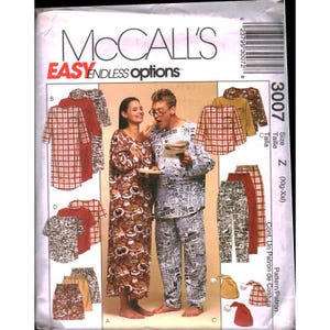 May include: A McCall's 3007 sewing pattern envelope for lounge wear. The front displays illustrations of various garments including a long robe, a button-down shirt, and trousers in plaid and newspaper print fabrics, with a photo of two people wearing them.