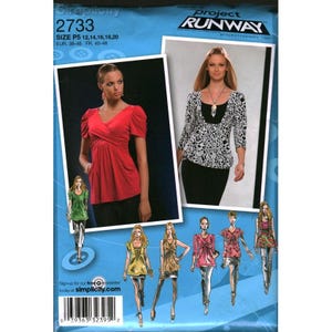 May include: Simplicity 2733 Project Runway sewing pattern envelope featuring illustrations and photographs of tops with various sleeve lengths and necklines. The blue packaging displays size P5, 12-20, and includes a barcode at the bottom.