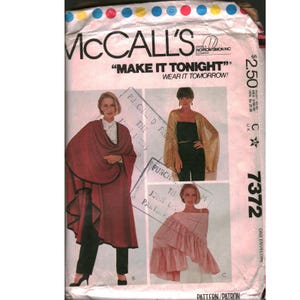 May include: A vintage McCall's sewing pattern envelope. The envelope features images of women wearing garments made from the pattern. The text "MAKE IT TONIGHT" and "WEAR IT TOMORROW!" is displayed. The pattern number is 7372.