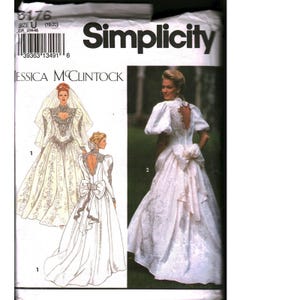 May include: A Simplicity sewing pattern envelope for a Jessica McClintock wedding dress, model 8176, size U. The packaging displays illustrations and a photograph of a white gown featuring puff sleeves, a heart-shaped back cutout, and a large bow.