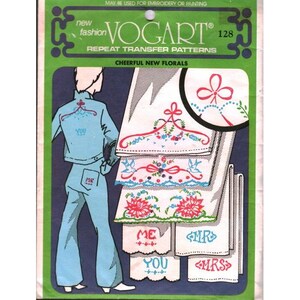 May include: A vintage Vogart 128 repeat transfer pattern packet. The packet features a blue denim outfit illustration with the words "YOU" and "ME". The packet also shows floral embroidery designs for towels with the words "ME", "YOU", "MR", and "MRS".