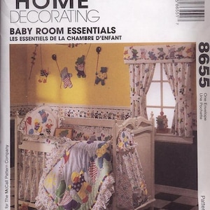 May include: A sewing pattern for a baby's nursery featuring a crib, curtains, and a mobile with animal characters. The pattern is titled "Baby Room Essentials" and includes instructions for making a quilt, crib skirt, and window valance. The pattern is from McCall's Home Decorating.