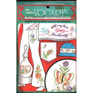 May include: A New Fashion Vogart 713 repeat transfer pattern sheet for embroidery or painting. The packaging features illustrations of floral, butterfly, and bird motifs, along with the text All my Love Darling, displayed on clothing and accessories.