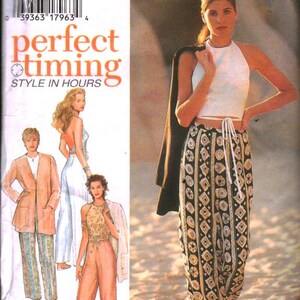 May include: A fashion magazine cover featuring a woman in a white halter top and patterned pants. The pants have a black background with a repeating geometric design in beige. The cover also shows other outfit ideas.