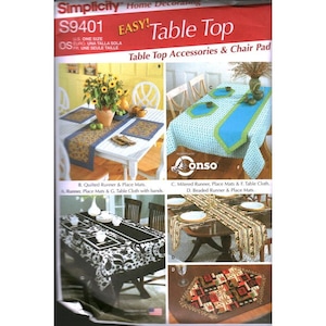 May include: Simplicity S9401 sewing pattern envelope for home decorating table top accessories and chair pads. The cover displays four distinct table setting designs featuring runners, place mats, and tablecloths with various patterns and colors.
