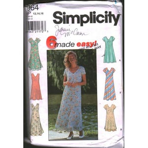 May include: Simplicity sewing pattern featuring six dress designs. The pattern includes a woman wearing a floral print dress. The text on the pattern reads "6 made easy!" and includes the designer's signature. The pattern number is 964.