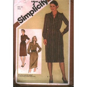 May include: Simplicity sewing pattern featuring a woman in a striped dress. The pattern includes illustrations of different dress styles, with the text "SIZE 12 MISS" and "S50" visible. The pattern is designed for Miss Petite sizes.