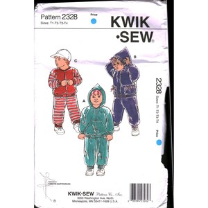 May include: A sewing pattern package labeled "Pattern 2328" with illustrations of children's outfits. The outfits include a red jacket and pants, a blue hooded jacket and pants, and a teal hooded jacket and pants. The package also includes the "KWIK SEW" logo.