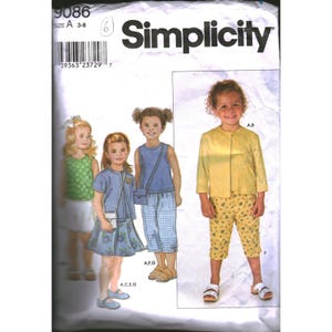 May include: Simplicity sewing pattern for children's clothing, sizes A 3-8. The pattern features illustrations of girls wearing various outfits, including a yellow jacket and patterned capri pants. The pattern number is 9086.