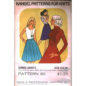 May include: A vintage Kandel Patterns for Knits envelope featuring illustrations of three outfits with gored skirts. The text reads GORED SKIRTS, SIZE 6 to 20, four and six gore; eight gore stitched pleat, elastic waist, PATTERN 60, and FROM A PROFESSIONAL KNITTING MILL.