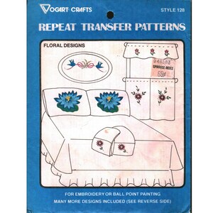 May include: Vogart Crafts Style 128 Repeat Transfer Patterns package for embroidery or ball point painting. The blue packaging displays floral designs including blue lotus flowers on pillows, a valance, and a bedspread with a ruffled edge.