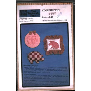 May include: A pattern for Country Pig crafts, featuring a pink pig in a hoop, a patchwork pig pillow, and an appliqued pig pillow. The pattern includes instructions and materials needed for each project. The text "COUNTRY PIG" is at the top.