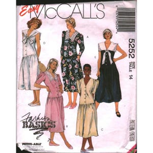 May include: A McCalls 5252 sewing pattern envelope featuring illustrations of five different dress styles. The designs include various necklines, sleeve lengths, and fabric patterns such as floral, striped, and solid colors. The text includes Easy McCalls, 5252, and Fashion Basics.