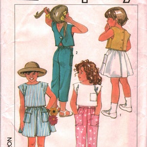 May include: Simplicity sewing pattern 6866 featuring children's clothing designs. The illustration shows various outfits, including a striped top and skirt, a teal top and pants, a white top and skirt, and a white top with pink heart-patterned pants.